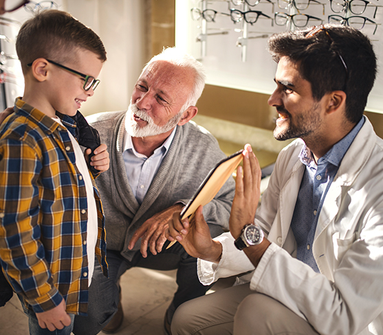 Child looking into a mirror at vision office