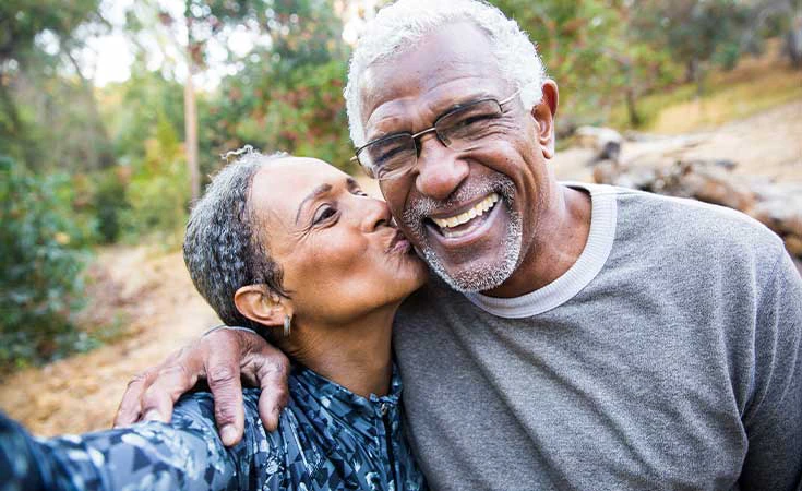 older couple smiling and embracing