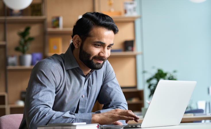 person looking at laptop computer